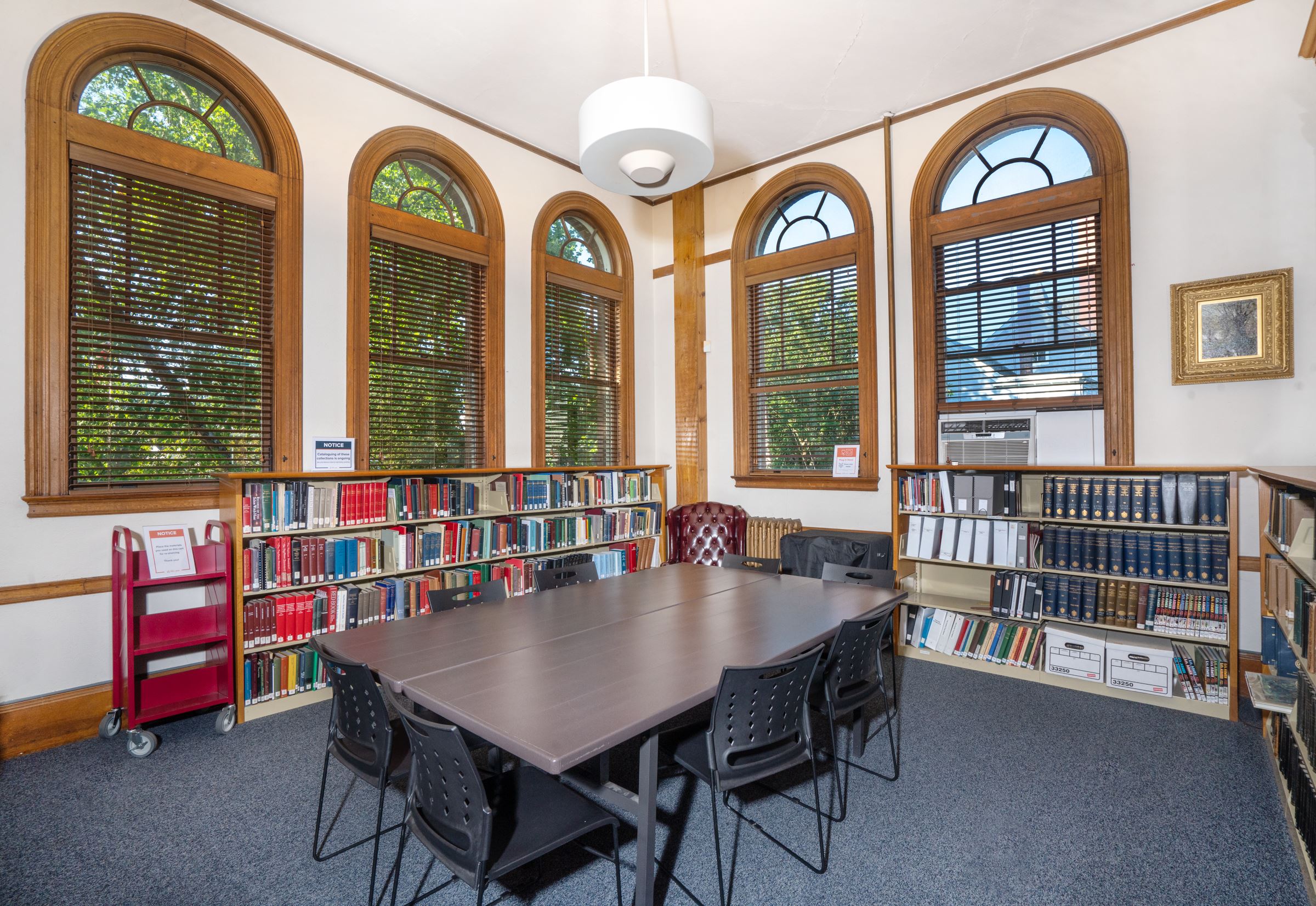 view of the large table with chairs and armchair in the Amesbury room